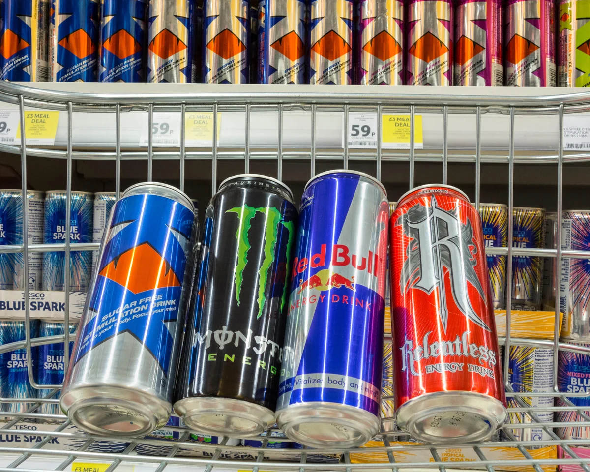 Energy drink cans displayed in a supermarket as the UK prepares to ban sales to children under 16.