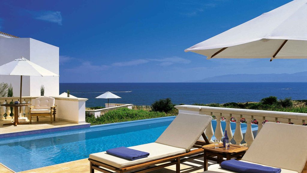 Tall luxury hotel tower overlooking RAF Akrotiri military base in Cyprus