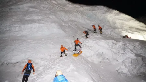 Snow-covered Spantik mountain peak in the Karakoram range during a climbing expedition
